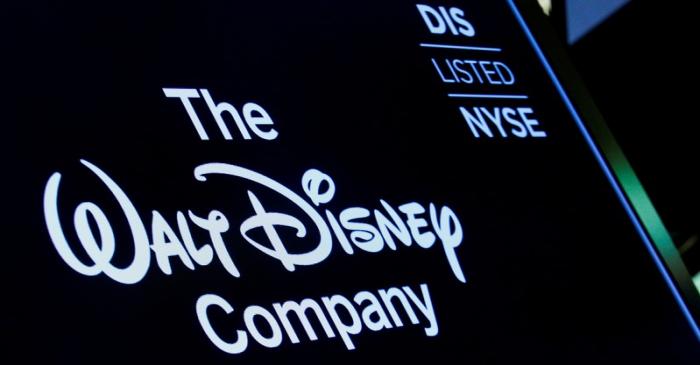 A screen shows the trading info for The Walt Disney Company company on the floor of the NYSE in