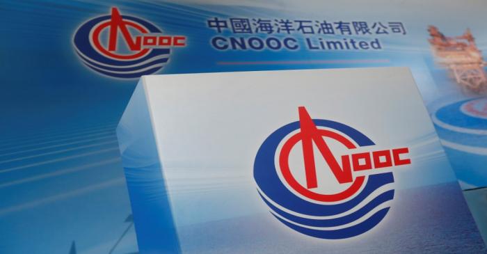 Logos of China National Offshore Oil Corporation (CNOOC) are displayed at a news conference in