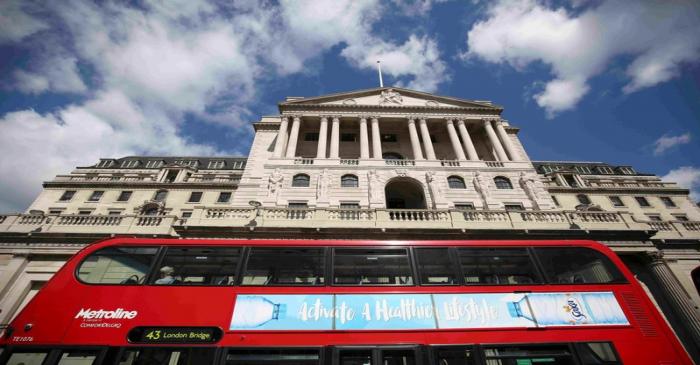 FILE PHOTO: A bus passes the Bank of England in London