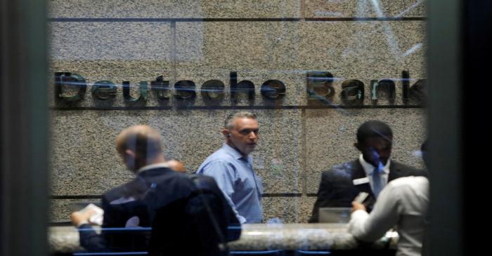 People are seen in the lobby of the U.S. headquarters of Deutsche Bank in New York City