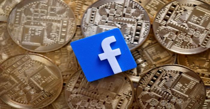 Facebook logo is seen on representations of Bitcoin virtual currency in this illustration