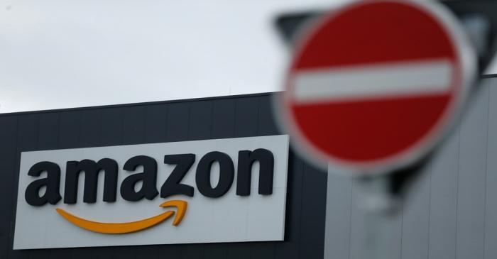 Workers and Verdi union members protest during strike action at a Amazon logistics centre in