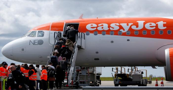 Passengers board an easyJet plane at the Nantes-Atlantique airport in Bouguenais near Nantes