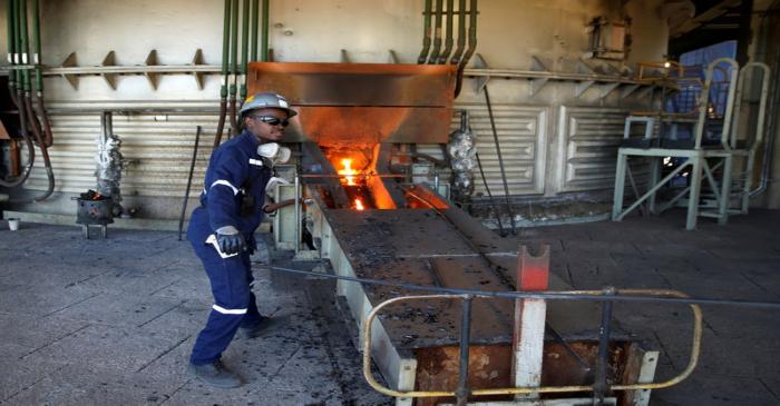 FILE PHOTO: A worker attends to machinery at a smelter plant at Anglo American Platinum's Unki