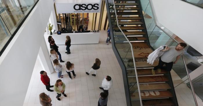 New employees wait in the lobby on their first day of work at the ASOS headquarters in London