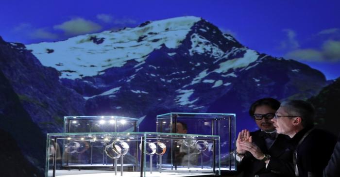 Visitors look at watches at the Montblanc stand, part of the Richemont luxury group, at the