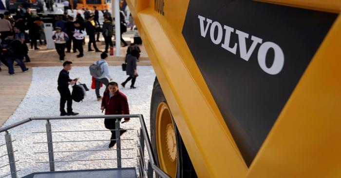FILE PHOTO: People visit heavy machinery of Volvo at Bauma China, the International Trade Fair
