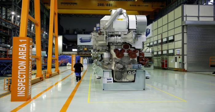 FILE PHOTO: An employee walks at a engine factory of CSSC Wartsila Engine (Shanghai) Co. Ltd 