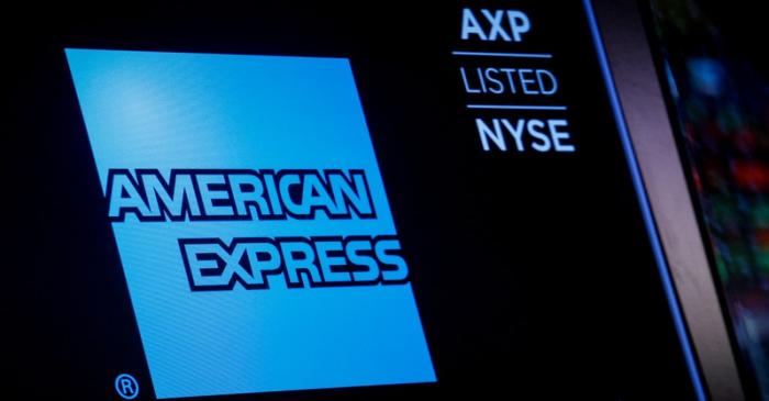 American Express logo and trading symbol are displayed on a screen at the NYSE in New York
