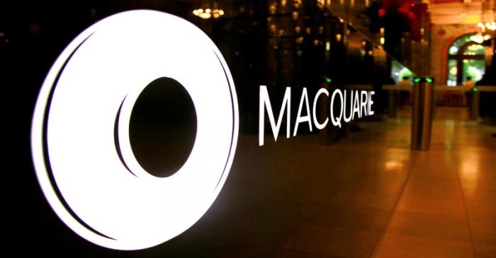 The logo of Australia's Macquarie Group Ltd adorns a desk in the reception area of their Sydney