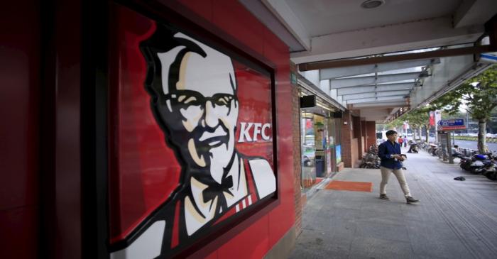 FILE PHOTO:  A customer walks out of a KFC restaurant in Shanghai