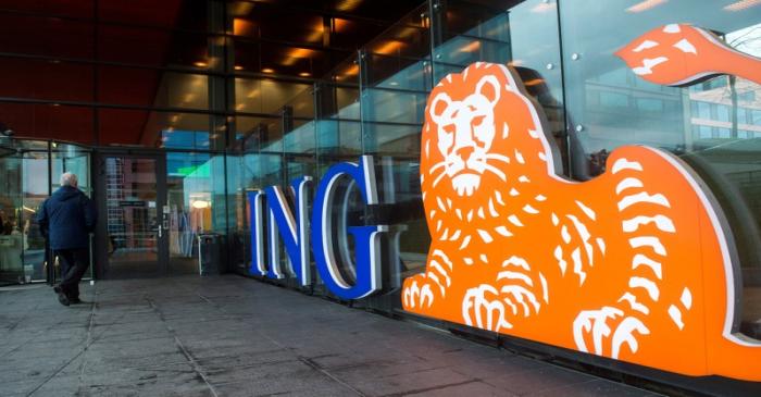 FILE PHOTO: A man walks past the logo of ING Groep NV at a branch office in Amsterdam