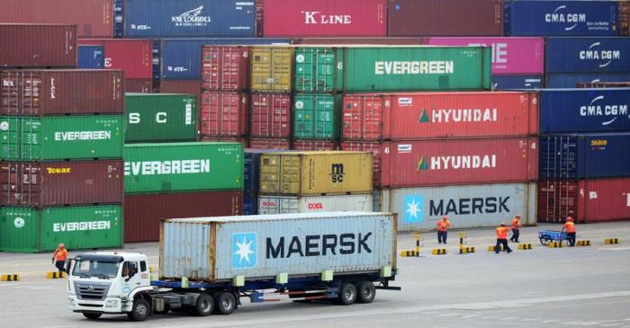 Truck transports a container at a port in Qingdao, Shandong