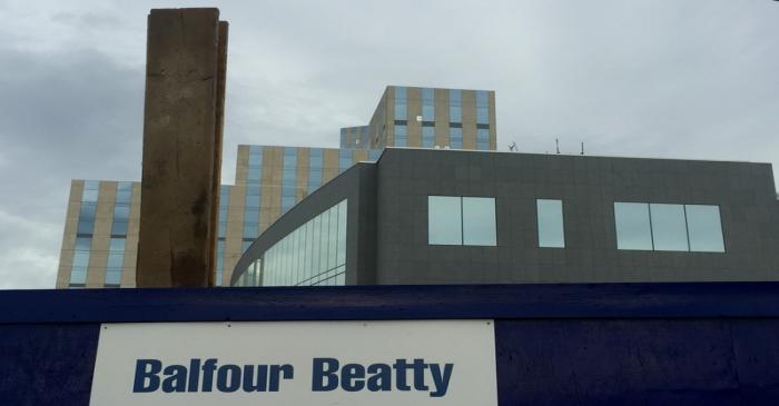 A sign of  Balfour Beatty is seen at a construction site in London