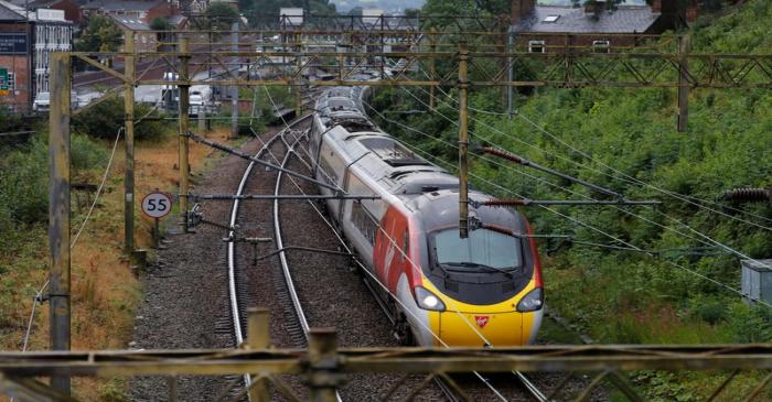 A Virgin Trains West Coast Mainline service from London to Manchester pulls out of the station