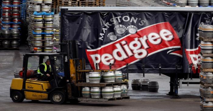 FILE PHOTO: A forklift truck driver loads a lorry with beer at Marston's Brewery in Burton upon