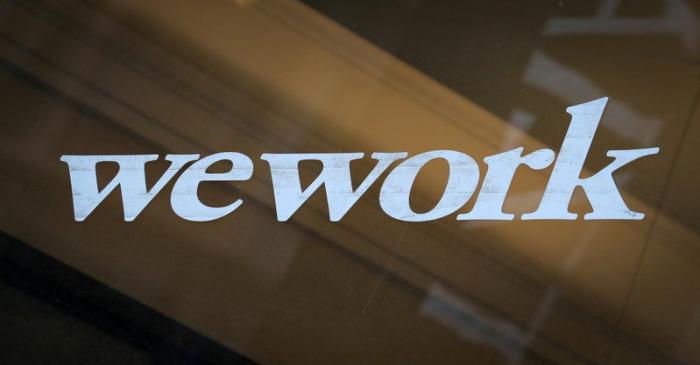 FILE PHOTO: The WeWork logo is displayed on the entrance of a co-working space in New York