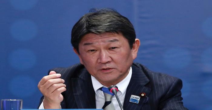Japan's Minister of Economic Revitalization Toshimitsu Motegi speaks during the signing