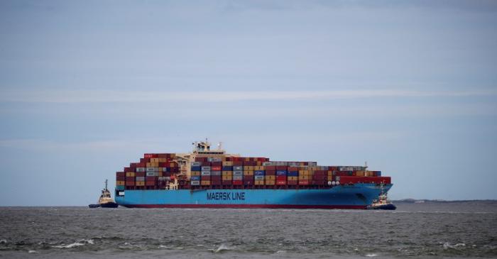 The Maersk Line container ship Maersk Sentosa is helped by tugs as it navigates the River