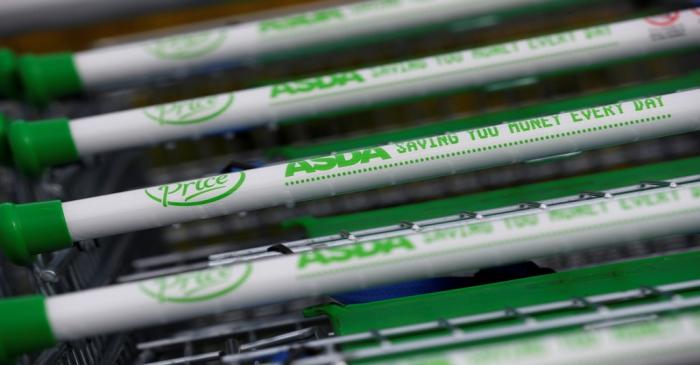 Shopping trolleys are seen outside a branch of ASDA in Altrincham.