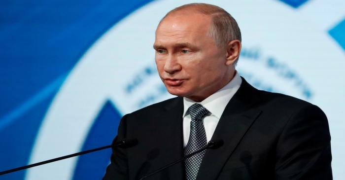 FILE PHOTO: Russian President Putin attends the International Forum 