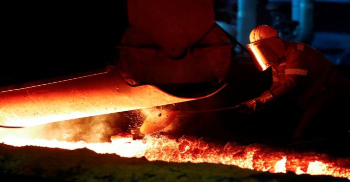 FILE PHOTO: A steel worker of Germany's industrial conglomerate ThyssenKrupp AG works near a