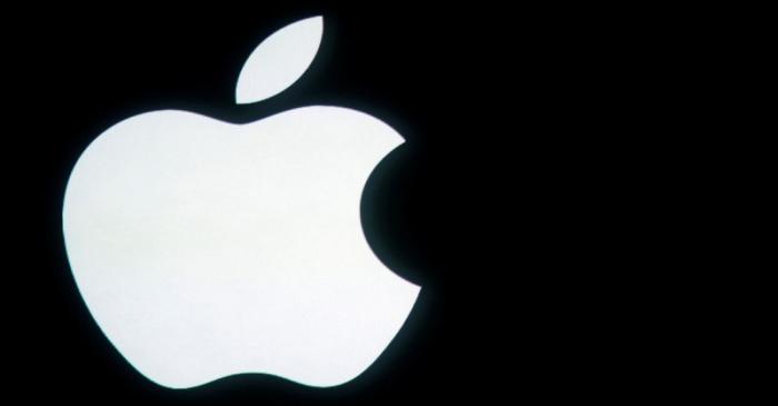 FILE PHOTO: The Apple logo is displayed onstage before a product unveiling event at Apple