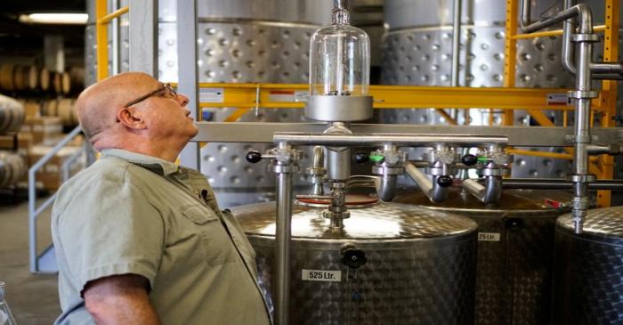 Herman Mihalich checks up on the most recent batch of rye whisky in his distillery in Bristol