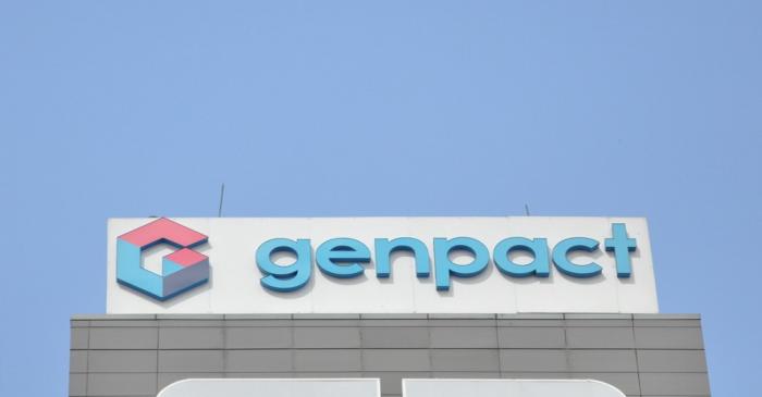 The logo of Genpact is seen on the facade of its building in Bengaluru