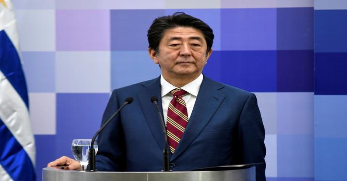 Japanese Prime Minister Shinzo Abe looks on while holding a joint press conferce with Uruguay's