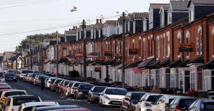 Estate agent signs on houses in the Selly Oak area of Birmingham