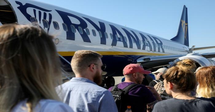 FILE PHOTO: Passengers board a Ryanair flight at the airport in Gdansk