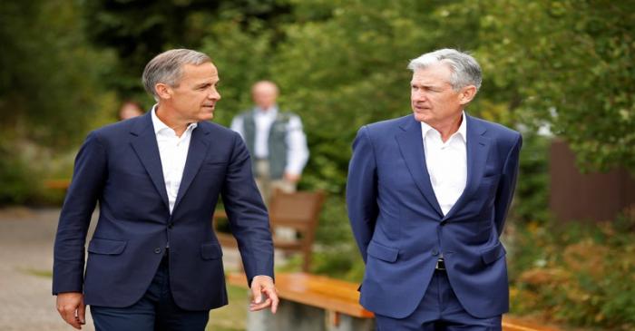 Federal Reserve Chair Jerome Powell and Governor of the Bank of England, Mark Carney, are seen