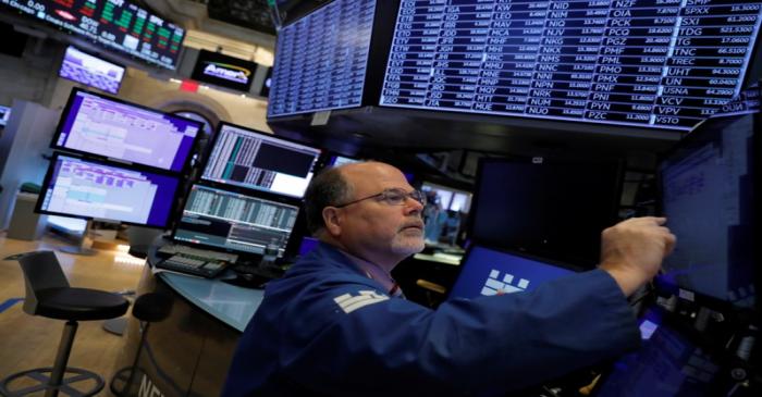 A trader works on the trading floor at the New York Stock Exchange (NYSE) at the opening of the