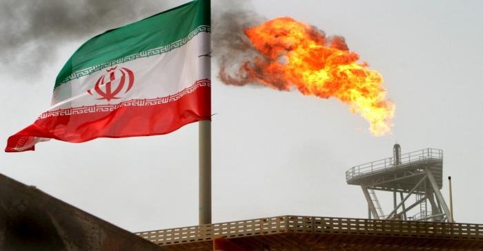 A gas flare on an oil production platform in the Soroush oil fields is seen alongside an
