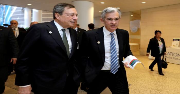 FILE PHOTO: European Central Bank (ECB) President Mario Draghi (L) and Federal Reserve Chairman