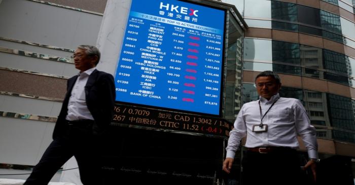FILE PHOTO: A panel outside the Hong Kong Exchanges displays top active securities in Hong Kong