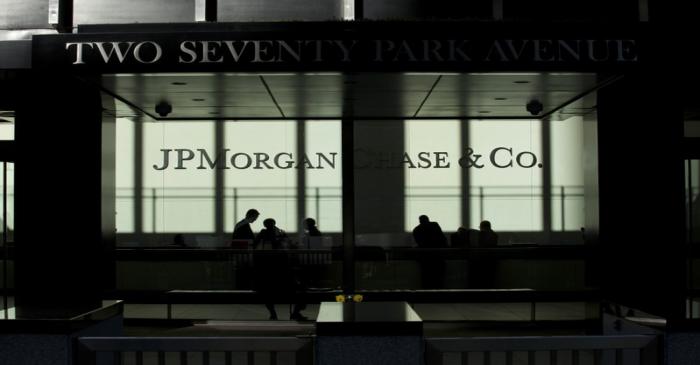 People walk inside JP Morgan headquarters in New York