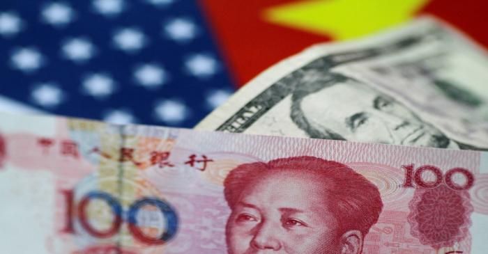 FILE PHOTO: FILE PHOTO: Illustration photo of U.S. dollar and China yuan notes