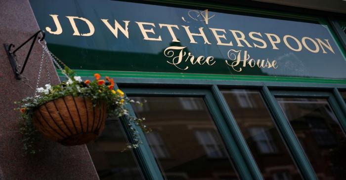 FILE PHOTO: A Wetherspoon's logo is seen at a pub in central London