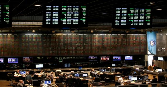 FILE PHOTO: Traders work on the floor of the Buenos Aires Stock Exchange