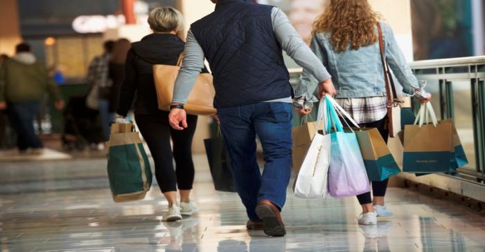 Shoppers carry bags of purchased merchandise at the King of Prussia Mall, United States'