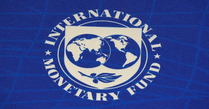 The logo of the International Monetary Fund (IMF), is seen during a news conference in Santiago