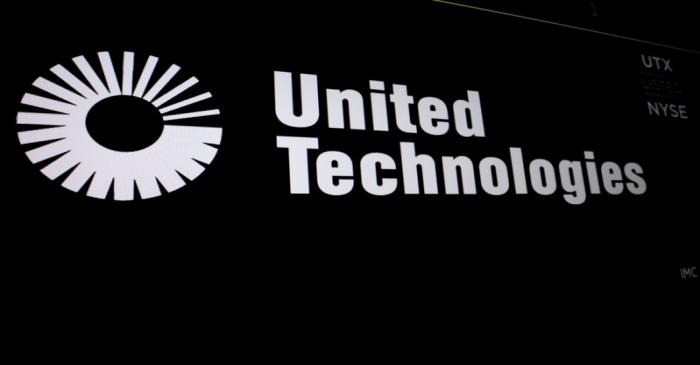 United Technologies logo is displayed on a screen at the post where it's stock is traded on the