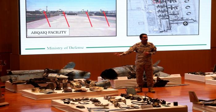 Saudi defence ministry spokesman Colonel Turki Al-Malik displays remains of the missiles which