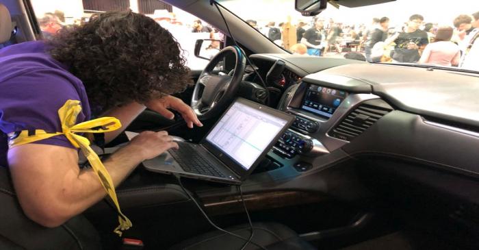 An attendee of the 2019 DEF CON cybersecurity event is seen at the conference's car hacking
