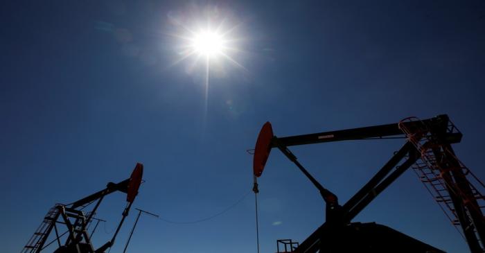 FILE PHOTO: Oil rigs are seen at Vaca Muerta shale oil and gas drilling, in the Patagonian