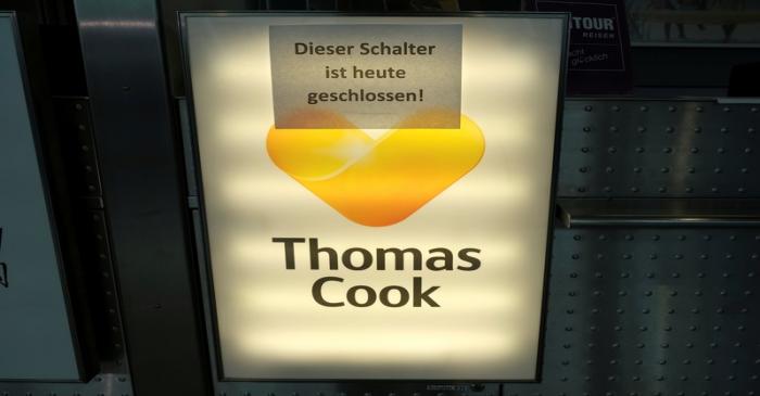 FILE PHOTO: An announcement at a Thomas Cook Airlines counter reads 