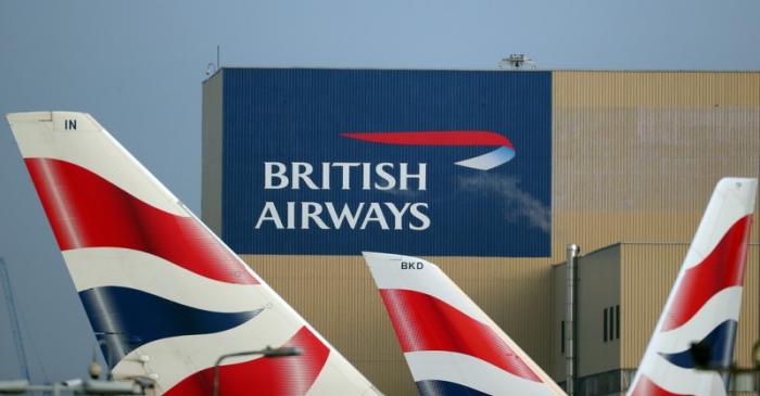 FILE PHOTO: British Airways logos are seen on tail fins at Heathrow Airport in west London