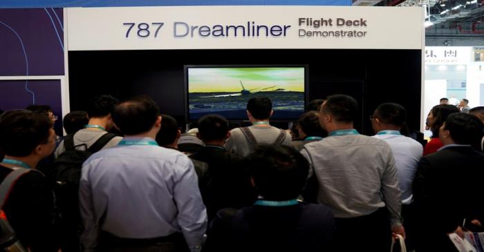 FILE PHOTO: People visit a booth of Boeing 787 Dreamliner during the China International Import
